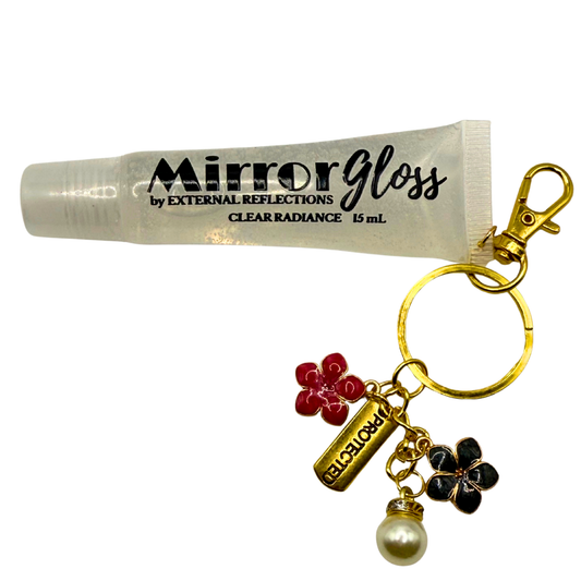 Clear Radiance Mirror Gloss by External Reflections — vegan clear lip gloss with subtle shine and gold affirmation charm.