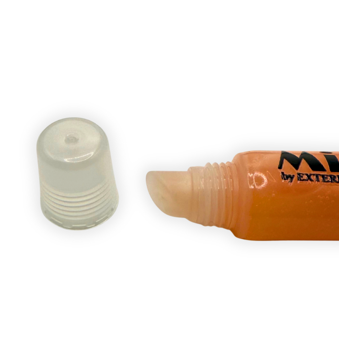 Close-up photo of the Golden Hour Mirror Gloss applicator tip with the cap removed, showing the smooth angled nozzle and clear tube.