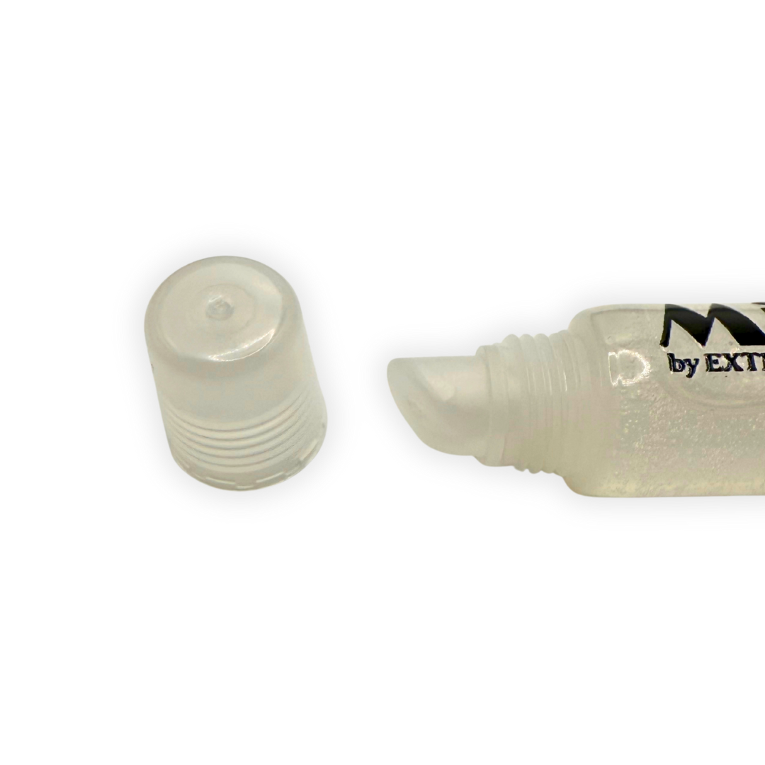 Close-up photo of the Clear Radiance Mirror Gloss applicator tip with the cap removed, showing the smooth angled nozzle and clear tube.