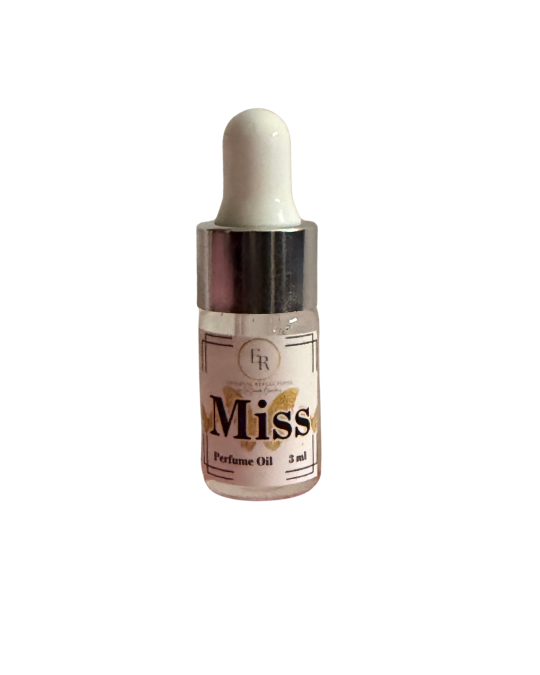 Close up of External Reflections trial size Miss perfume oil dropper bottle showing label.